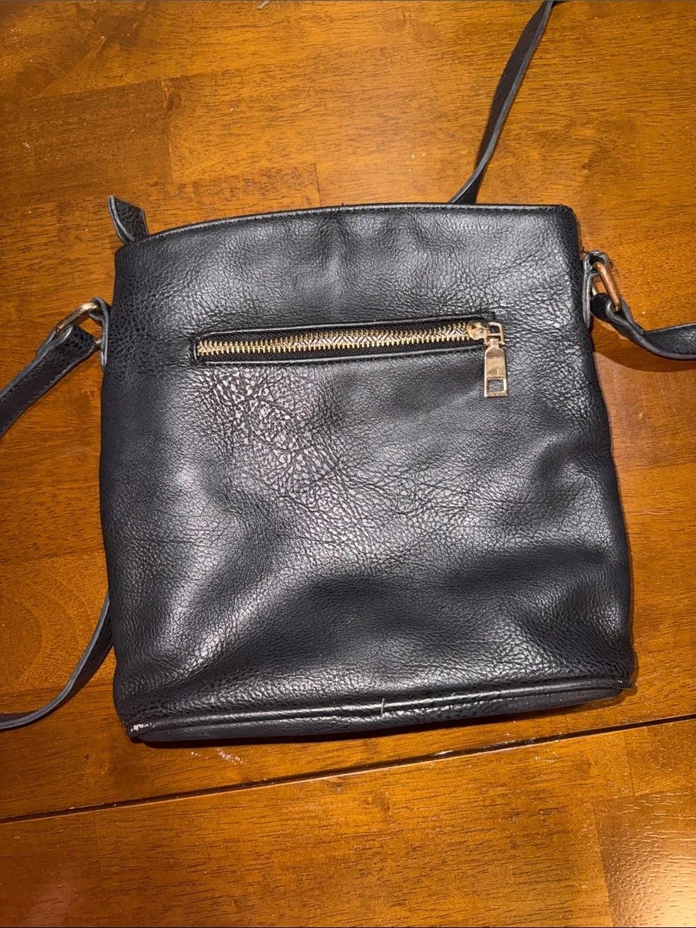 Classic Black Leather Crossbody Bag with Gold Zippers